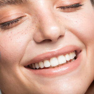 Headshot Happy Aged Female Laughing Posing On Grey Studio Background