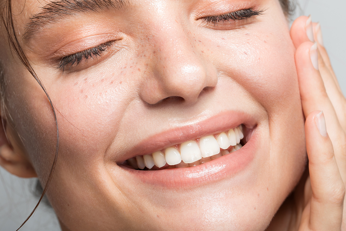 Headshot Happy Aged Female Laughing Posing On Grey Studio Background